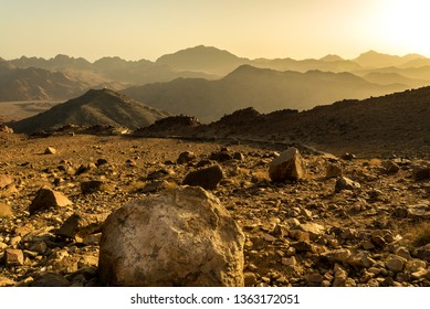 Middle East or Africa, picturesque bare mountain range and a large sandy valley desert landscapes landscape photography. Horizontal frame - Shutterstock ID 1363172051