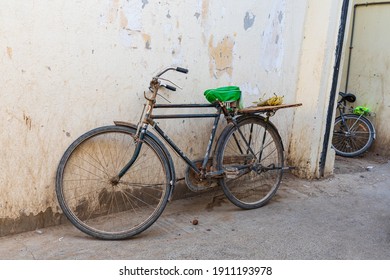 Middle East, Arabian Peninsula, Oman, Al Batinah South, Sinaw. Oct. 24, 2019. Bicycles in an alley in Sinaw, Oman.