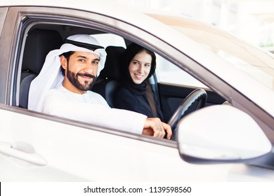 Middle Eastern Arab Couple Traveling In Car, Man Driving