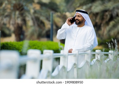 Middle Eastern Arab Emirati Man Using Mobile Phone