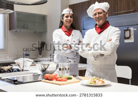 Middle Eastern chefs preparing Eid Ramadan iftar dinner in a modern home kitchen with family-style dishes