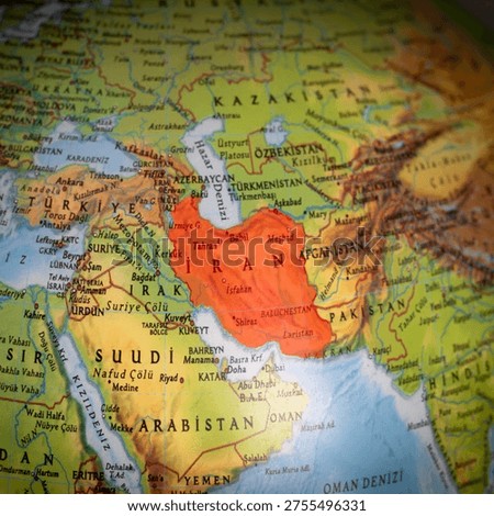Middle Eastern countries. The United States and Israel have declared war on Iran. The map of Iran is highlighted in red on the globe model. A section of the world map. Political tension or crisis. Top view, above, up. No people, nobody. 