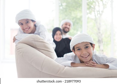 Middle Eastern Family At Home On Couch