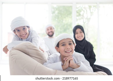 Middle Eastern Family At Home On Couch