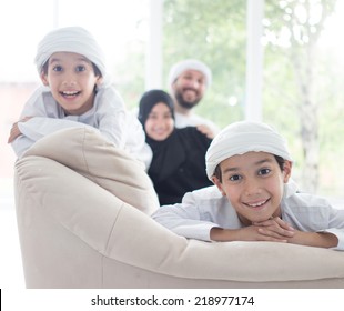 Middle Eastern Family At Home On Couch