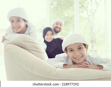 Middle Eastern Family At Home On Couch