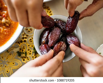 Middle Eastern Family Sharing And Eating Dates Together