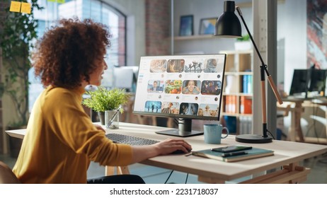 Middle Eastern Female Working in Creative Agency, Looking Through Social Media Trends for Marketing. Successful Specialist Using Computer with Video Streaming Platform on Screen Display - Powered by Shutterstock