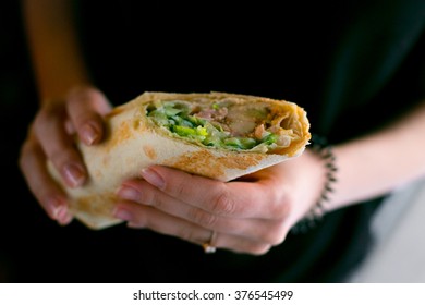 Middle Eastern Kebab In A Female Hands (chicken Wrap)