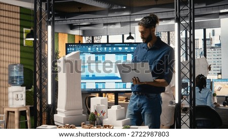 Middle eastern property contractor evaluate a housing construction with architectural software and 3D models to respect zoning regulations and layout rules. Urban development master plan.