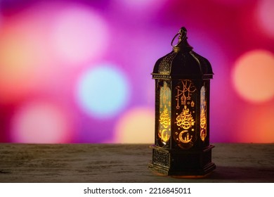 Middle Eastern Style Lantern With Golden Light On Blurred Background Of Colorful Lights