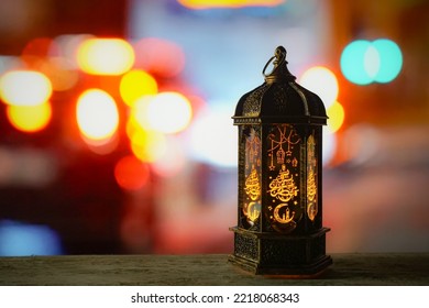 Middle Eastern Style Lantern With Golden Light On Blurred Background Of Colorful Lights