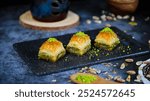 Middle eastern sweets baklava with pistachio Turkish traditional dessert baklava with powder and pistachio served Pistachio Baklava sweets Fistikli Baklava