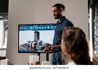 Middle eastern urban developer presenting blueprints master plan to colleagues, hosting a briefing for construction design ideas and city planning. Working on redevelopment in real estate.