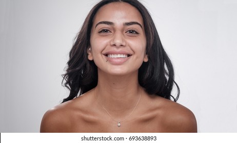 Middle Eastern Woman Smiling With No Makeup