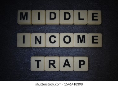 Middle Income Trap, Word Cube With Background. 