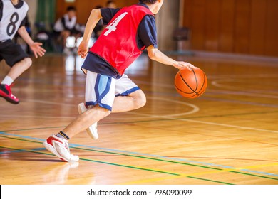 Middle School Student Playing Basketball Game