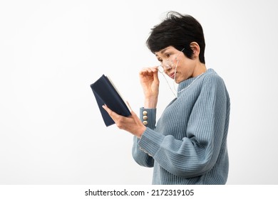 Middle Woman Reading With Reading Glasses