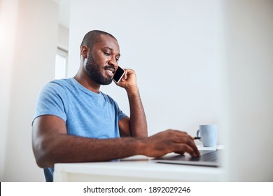 Middle-aged Adult Moving His Hand On A Touchpad While Having A Discussion During A Phone Call