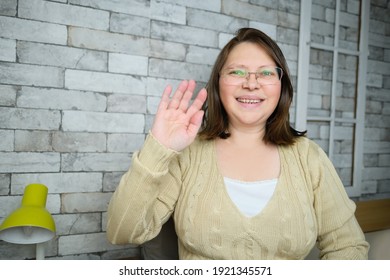 Middle-aged Adult Woman With Glasses Communicates From Home Via Video Link, Gestures With Her Hands, Concept Of Remote Education, Video Conferencing, Lockdown Covid-19