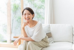 Middle-aged Asian Woman Relaxing At Home