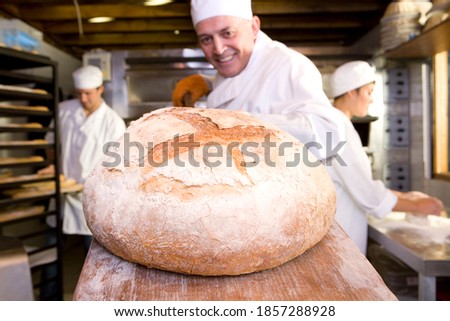 Similar – Image, Stock Photo Baking bread in a historic oven.