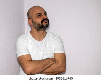 Middle-aged Brunette Male With Beard And Mustache. Thinking Man Trying To Decide