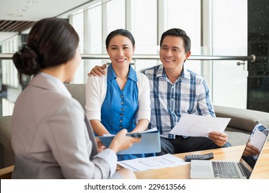 Middle-aged Couple At The Meeting With Real Estate Agent