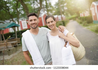 Middle-aged Couple On Vacation Walking In Camping