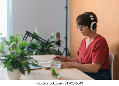 Middle-aged Female Radio Presenter Talking Into The Microphone And Reading News - Radio Broadcast Online Concept