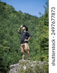 Middle-aged Japanese men enjoying summer leisure and travel in the mountains. Looking up and admiring the scenery. Images of adventure, etc. Vertical.