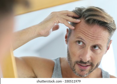 Middle-aged Man Concerned By Hair Loss