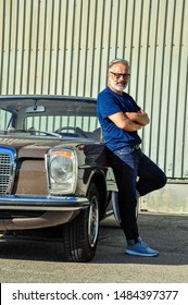 Middle-aged Man With His Vintage Car