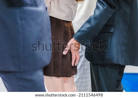 Middle-aged man molesting someone on the train
