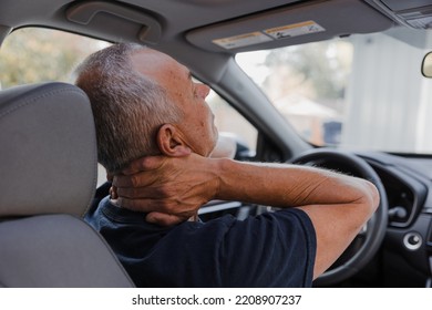 Middle-aged man with neck pain - Shutterstock ID 2208907237