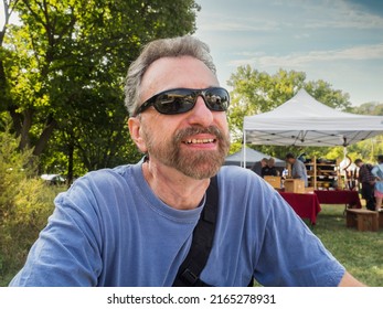 Middle-Aged Man At Outdoors Art Festival