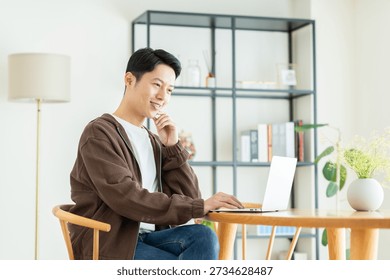 Middle-aged man using a computer at home