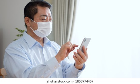 
Middle-aged man using a smartphone