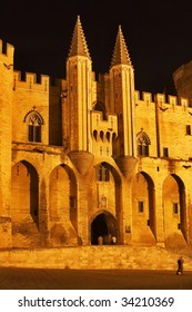 Middle-aged pope's palace in Avignon at night