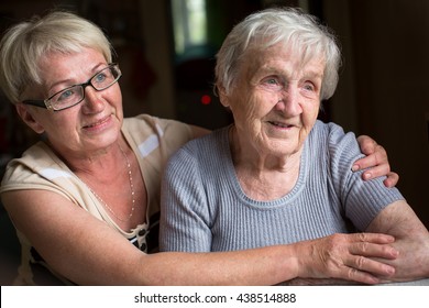 A middle-aged woman with her elderly mother.