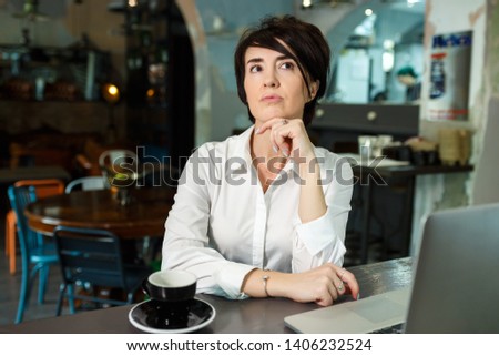 Similar – Young woman looking at cellphone