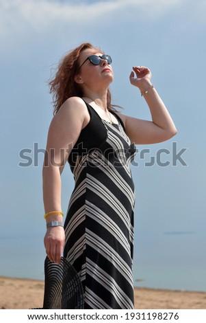 Similar – Portrait von einer jungen Frau mit Wind im Haar