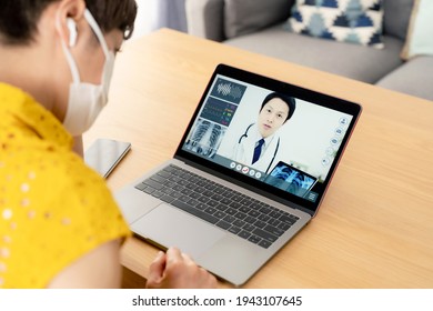 Middle-aged woman taking a Remote medicine. Telemedicine. - Shutterstock ID 1943107645