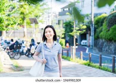 Middle-aged Woman Taking A Walk With A Relaxed Look