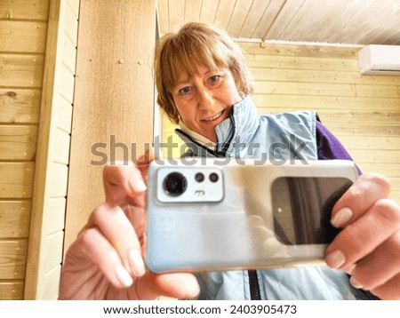 Similar – Image, Stock Photo funny twin sisters make a selfie with the smartphone