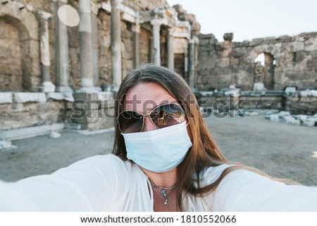 Similar – Woman Walking Through Building