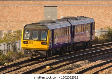 MIDDLESBROUGH, NORTH YORKSHIRE, UK - OCTOBER 9, 2012: Northern Rail DMU Class 142 No. 142025 Heads Through Middlesbrough With A Passenger Service To Darlington.