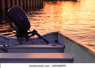 Middletown, CT / USA - June 7, 2019: Boat with an outboard motor parked near the marina at sunset