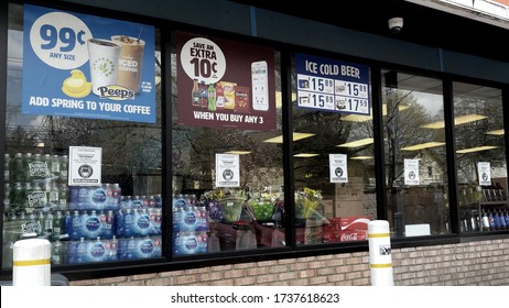 Middletown, NY / USA - 04/25/2020: A Cumberland Farms Convenience Store Posts Signs In Every Window To Inform Customers They Must Wear A Mask Inside To Protect Against COVID-19  Coronavirus 