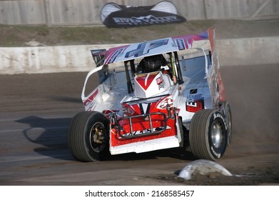 Middletown, NY, USA - April 2, 2022: Dirt Track Racer Billy VanInwegan Pitches His Stock Car Into A Turn At Orange County Fair Speedway In Middletown, NY.					